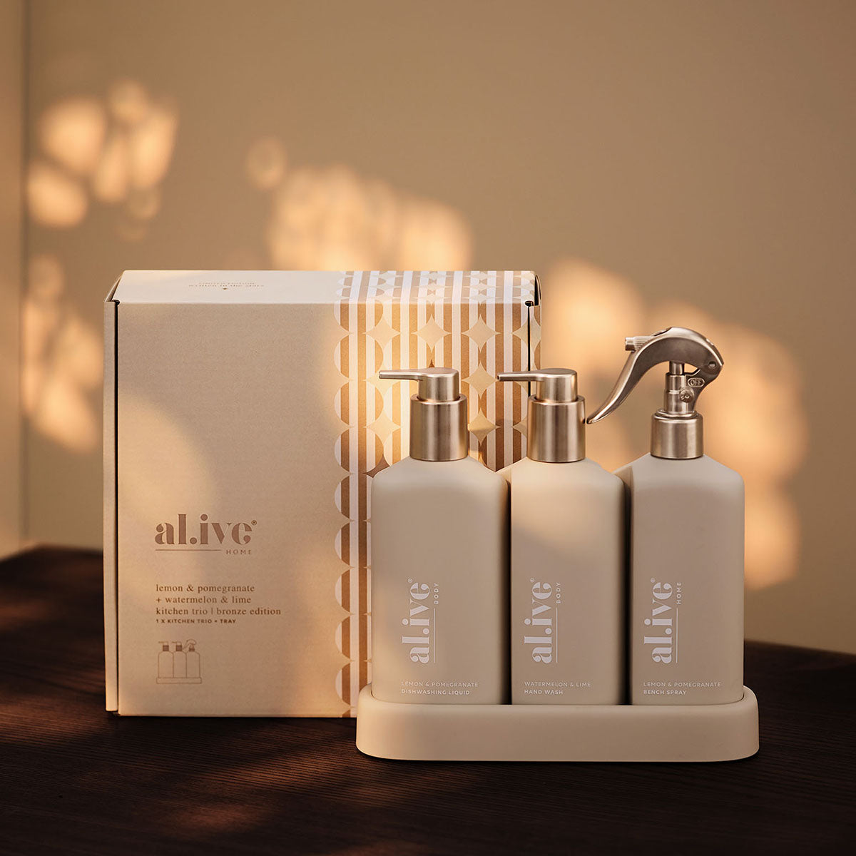 al.ive body Kitchen Trio Bronze Edition beside its festive gift box in warm afternoon light