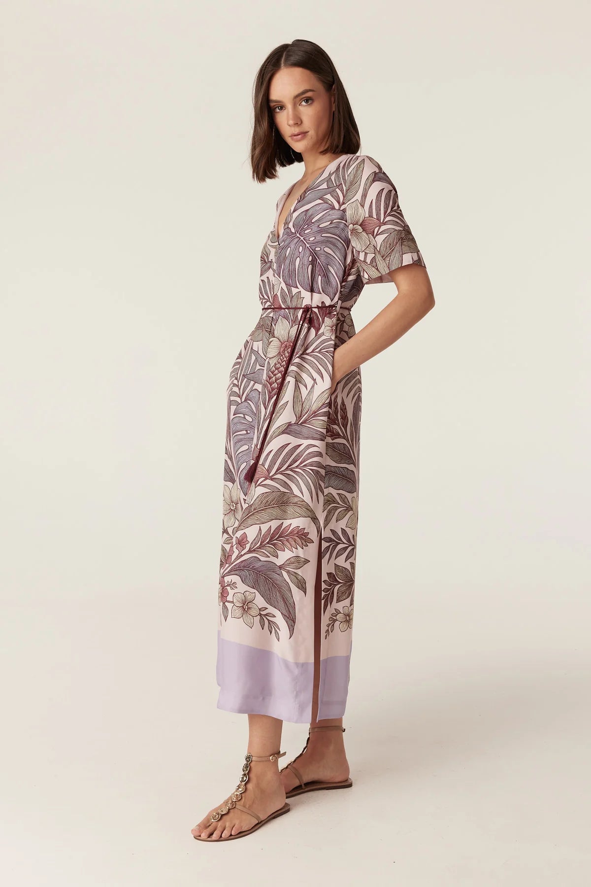 Cable Melbourne Erika Kaftan Dress in Paradise Print, styled with a raffia tote - side view