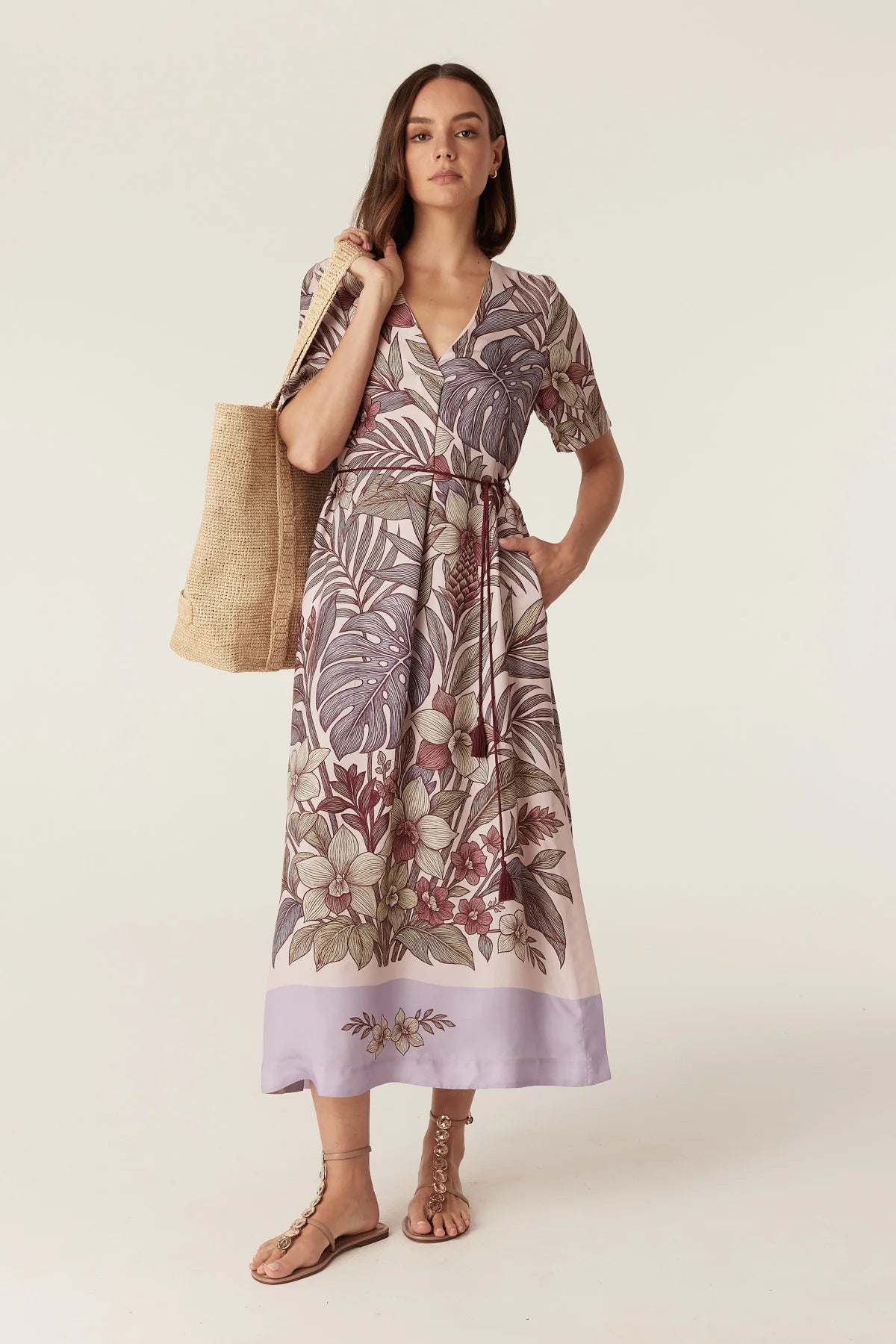 Cable Melbourne Erika Kaftan Dress in Paradise Print, styled with a raffia tote - front view