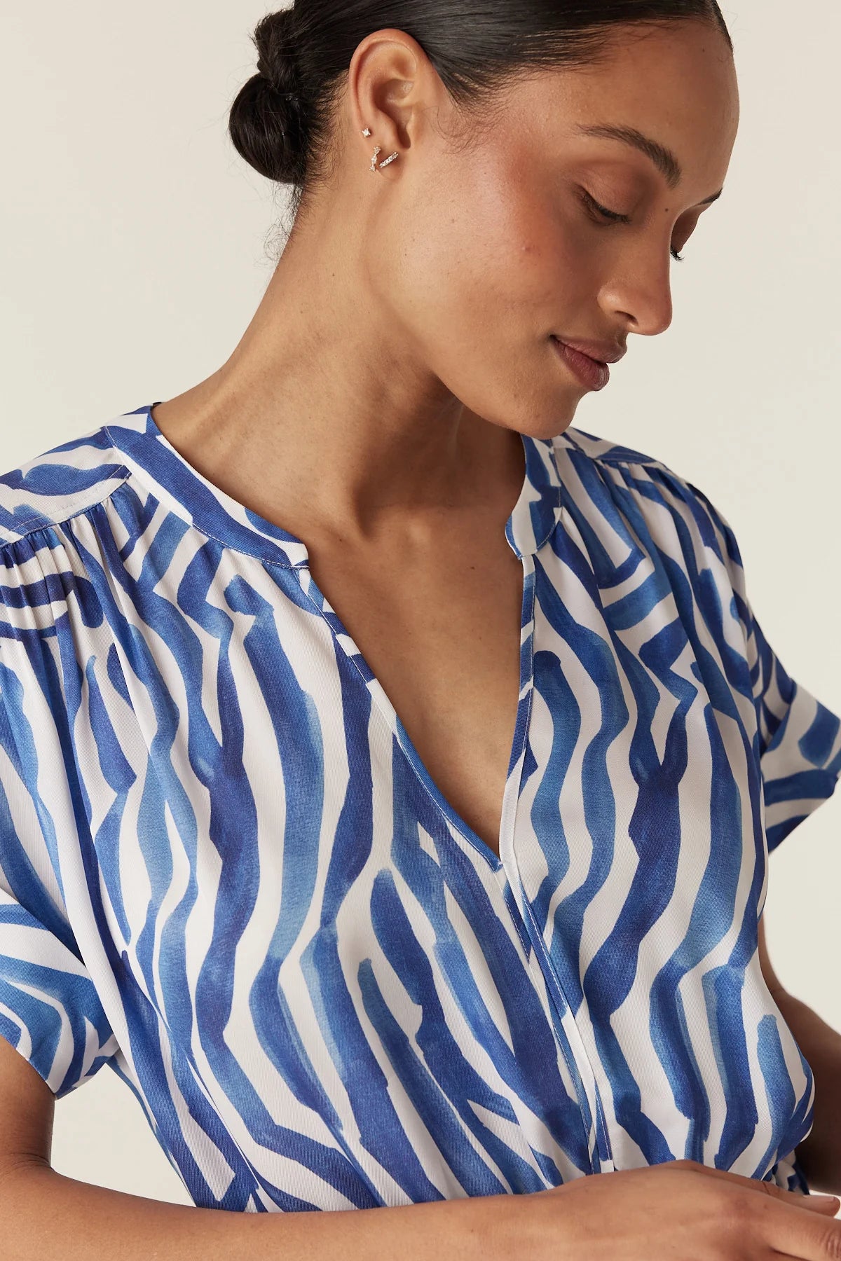 Cable Melbourne Sea Breeze Midi Dress in Blue Wave Print - close-up of the V-neckline and exclusive print