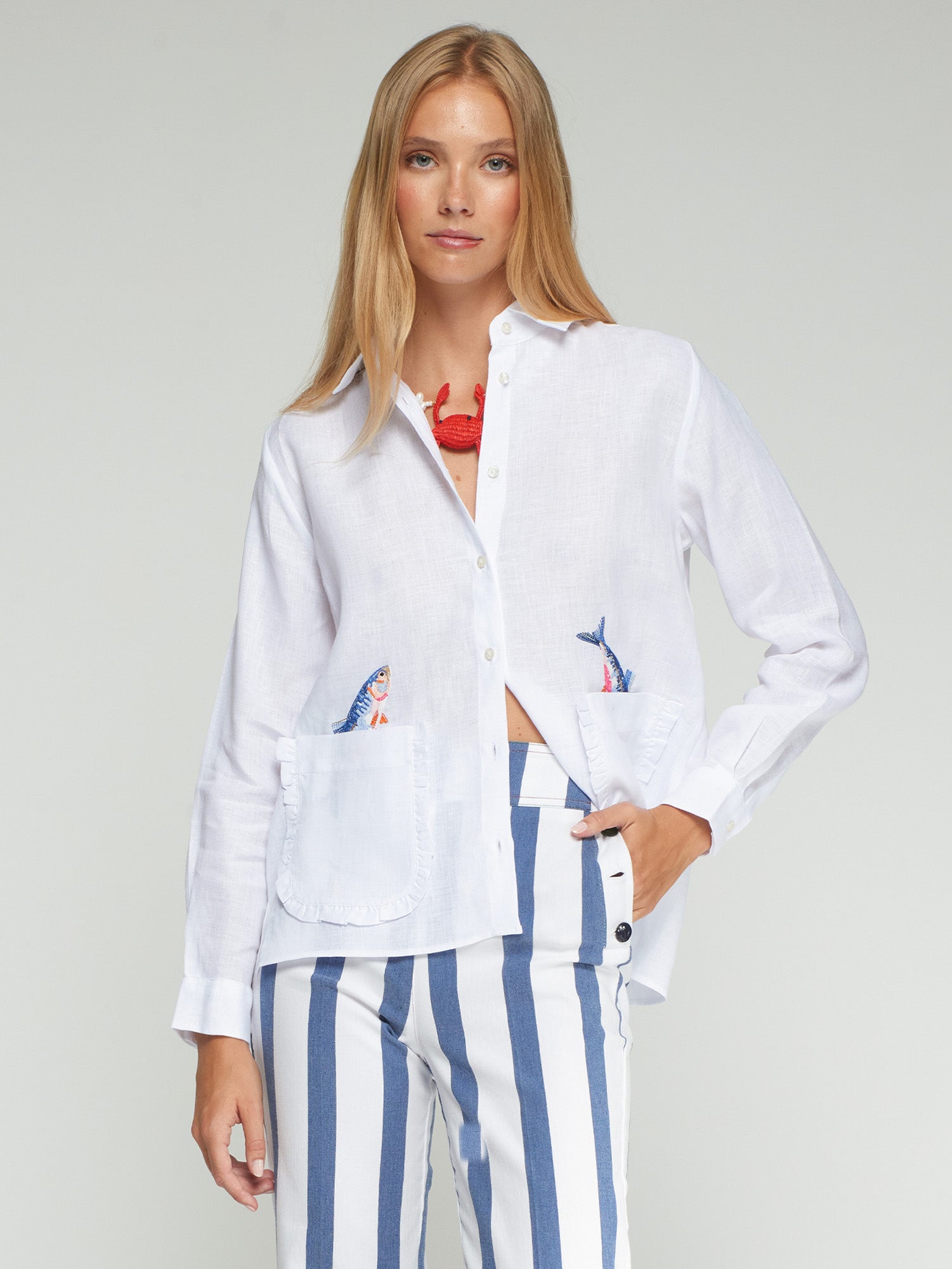 Vilagallo Embroidered Ruffle Pockets Linen Shirt in white, flat lay with embroidered fish ruffle pockets