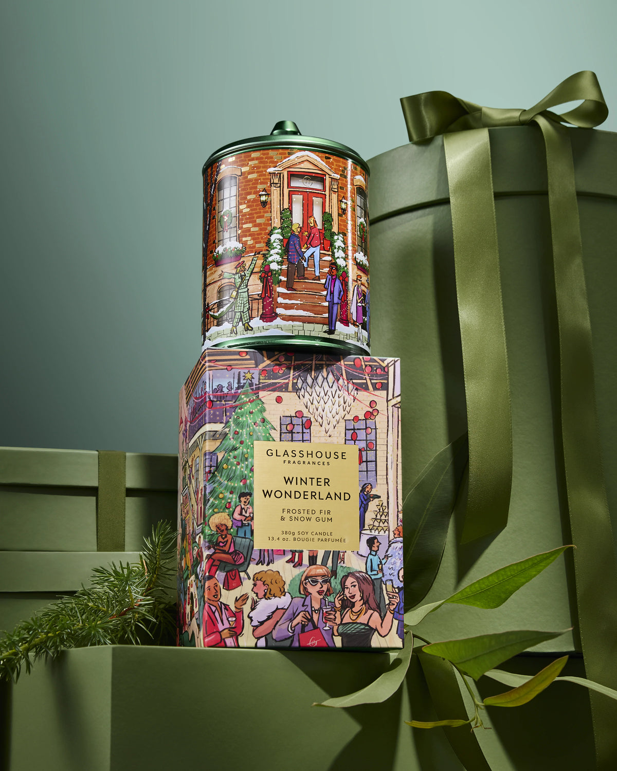 Glasshouse Fragrances Winter Wonderland 380g Candle stacked on its box among green gift boxes