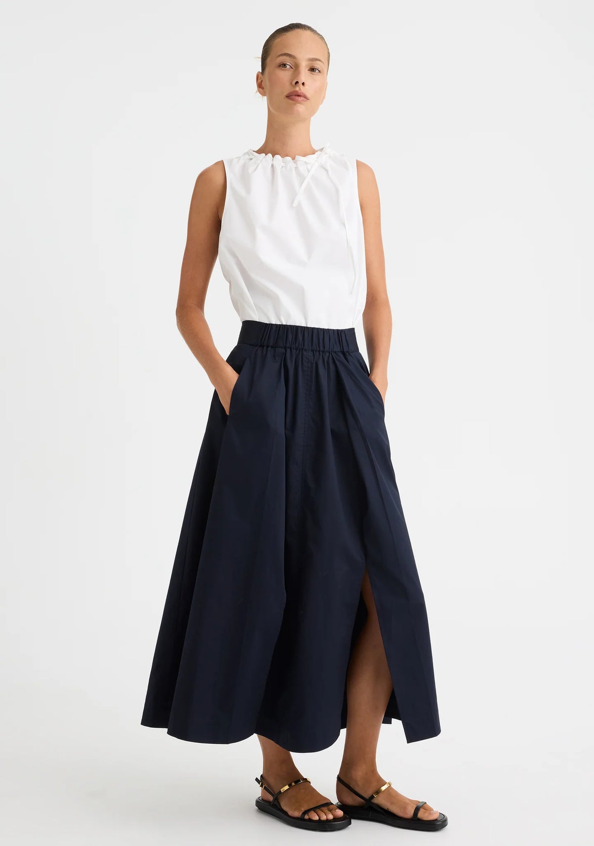Morrison Maddison Skirt in Navy, worn - front showing the hidden split
