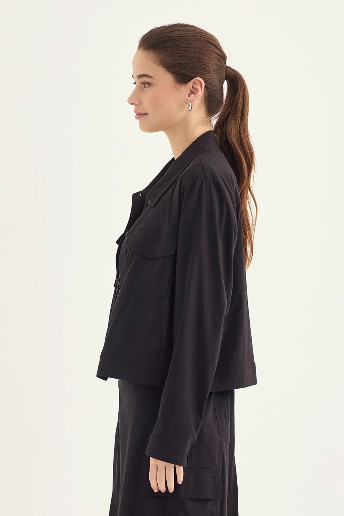 Verge Acrobat Icon Jacket in Black, worn - side