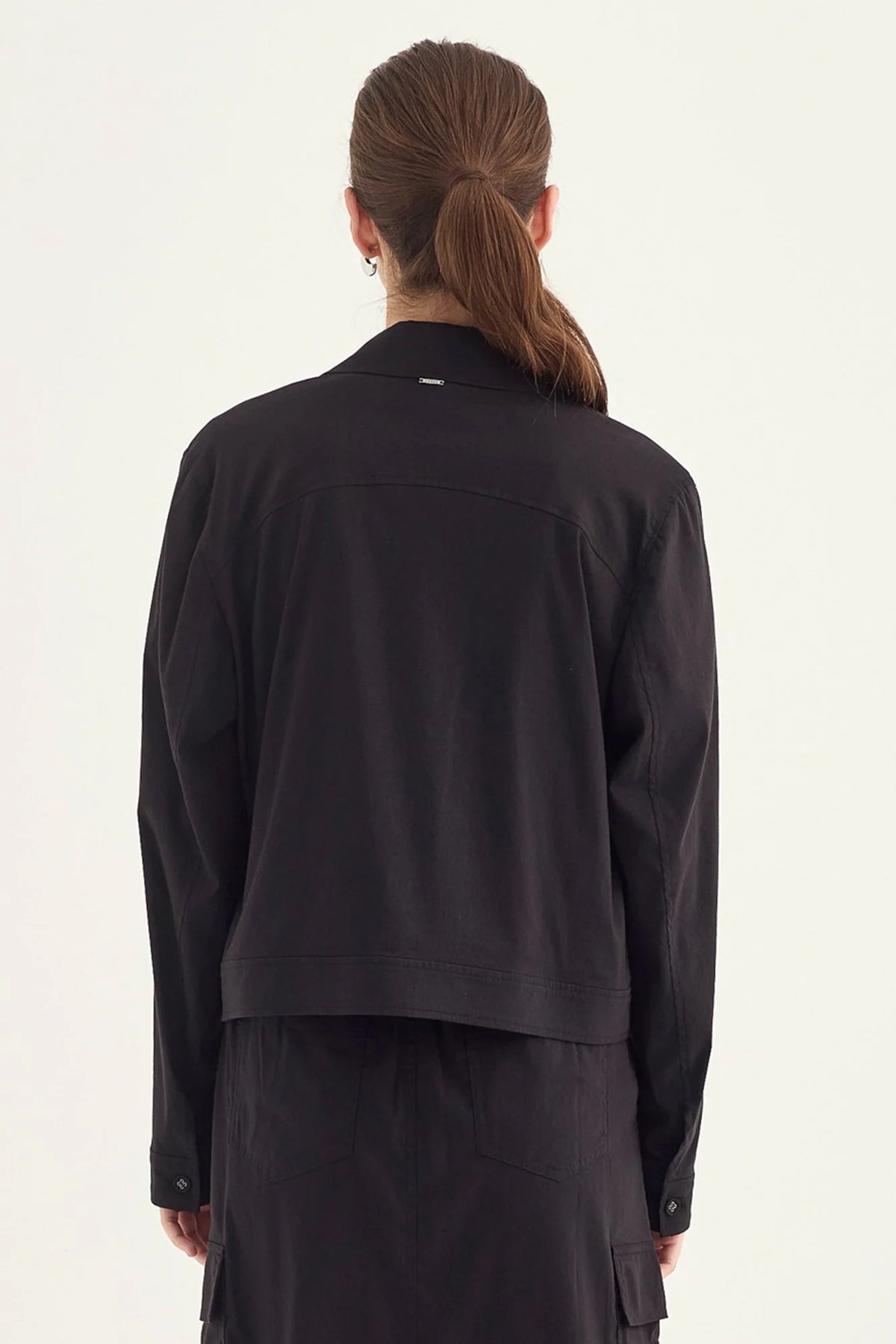 Verge Acrobat Icon Jacket in Black, worn - back showing yoke