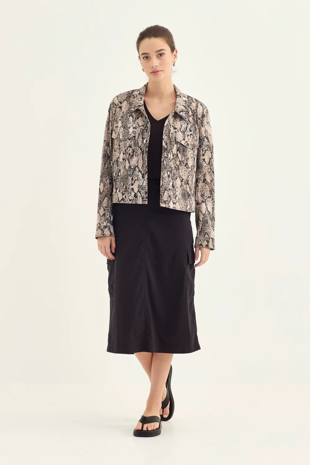 Verge Acrobat Porter Skirt in Black, worn - front styled with the Acrobat Serpent Jacket