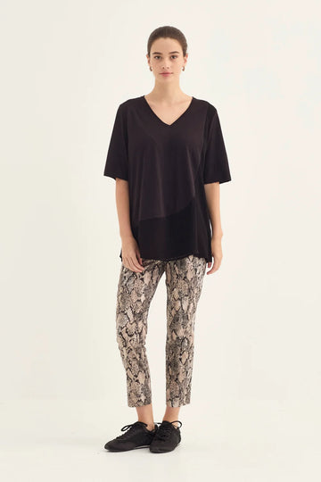 Verge Acrobat Serpent 7/8 Pant in Serpent Print, worn - front